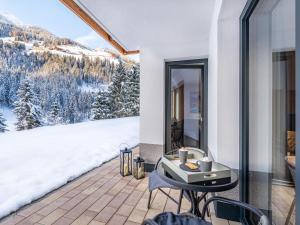 a balcony with a view of a snowy mountain at Apartment Leo-1 by Interhome in Kappl