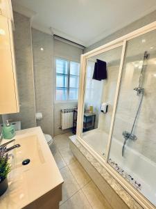 a bathroom with a shower and a sink and a toilet at CASA GLORIA in Combarro