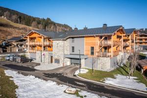 an aerial view of a lodge with a road in front at Apartment Clematis Les Gets- BY EMERALD STAY in Les Gets