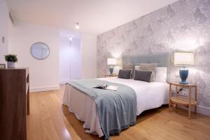 Posteľ alebo postele v izbe v ubytovaní Genteel Home San Agustín
