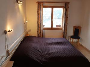 Ein Bett oder Betten in einem Zimmer der Unterkunft Apartment Tga Stgirat Dachgeschoss by Interhome