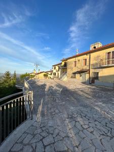 a stone walkway in front of a building at Violet Home Irpinia in Montemarano