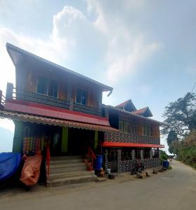 a colorful house with steps in front of it at Athithi homestay in Darjeeling