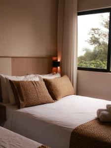 Cama ou camas em um quarto em Iguassu Express Hotel
