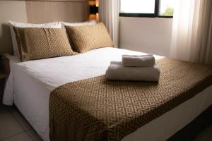 Cama ou camas em um quarto em Iguassu Express Hotel