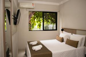 Cama ou camas em um quarto em Iguassu Express Hotel