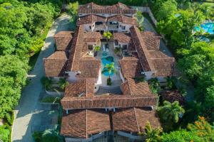 an aerial view of a house with a pool at The Cove at Playa Ocotal in Coco
