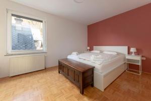 מיטה או מיטות בחדר ב-Lakeview Bled Heaven Apartments