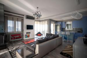 a living room with a couch and a table at F & B Collection - Seaview 2 Bedroom Flat in Thessaloniki