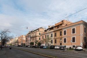 a city street with buildings and cars parked on the street at Major 93 Guesthouse in Rome
