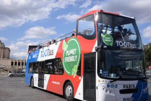 a double decker bus parked in a parking lot at Eiffel Tower Oasis 30m from Eiffel Tower in Paris