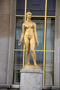 a statue of a man standing in front of a building at Eiffel Tower Oasis 30m from Eiffel Tower in Paris