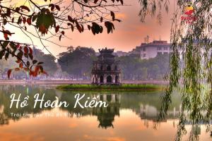 a temple in the middle of a body of water at Hoan Kiem lake center in Hanoi