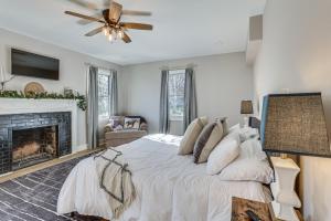 a bedroom with a large bed and a fireplace at Pet-Friendly Shelbyville Home with Fire Pit! in Shelbyville