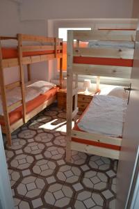 two bunk beds in a room with a floor at Immensee App B in Ehst