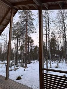 a screened in porch with snow on the ground at Villa Länsitaalo in Kittilä