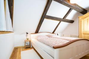 a bedroom with a bed in a attic at HW App 7 in Welt