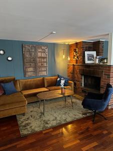 a living room with a couch and a coffee table at Ingrids Apartments in Eidfjord