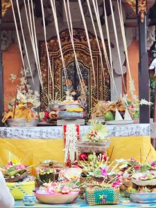 a display of food on a table with baskets of food at Wikan House in Bebandem