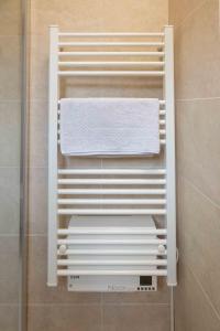 a towel rack in a bathroom with a towel at Well located apartment in Paris in Paris