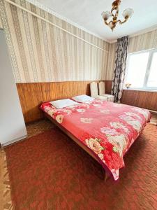 A bed or beds in a room at Гостевой дом Шынар