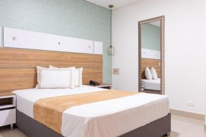 Voodi või voodid majutusasutuse Infinity Hotel toas