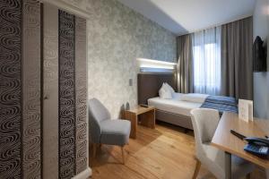 Postel nebo postele na pokoji v ubytování Hotel Goldene Sonne