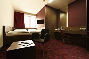 Postel nebo postele na pokoji v ubytování Kongres Hotel Roca