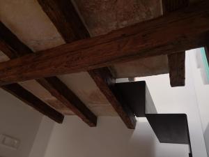 an overhead view of wooden beams on a ceiling at Il Torrione in Terlizzi