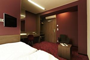 TV a/nebo společenská místnost v ubytování Kongres Hotel Roca