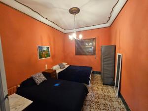 Postel nebo postele na pokoji v ubytování Fabrica de Sueños