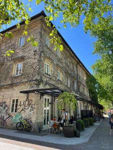 a building with graffiti on the side of it at Cosy Castle Flat in Ljubljana Center - FREE PARKING in Ljubljana