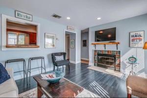 a living room with a fireplace and a tv at Condo in the Heart of Nashville - unit794 in Nashville