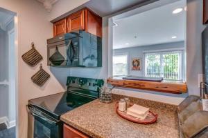 a kitchen with a stove and a counter top at Condo in the Heart of Nashville - unit794 in Nashville