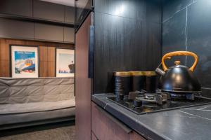 a tea kettle on top of a stove in a room at Canin Mountain Lodge in Sella Nevea