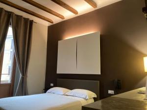 Posteľ alebo postele v izbe v ubytovaní Hotel Calypso