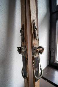 a wooden door with a latch on a wall at VacationClub - Ski Lodge Szczyrk Pokój 6 in Szczyrk