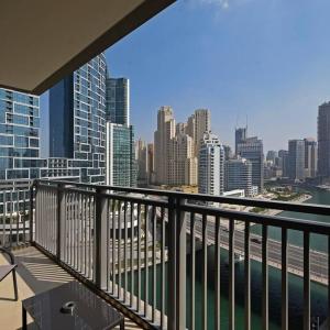 a balcony with a view of a city skyline at Beachwalk Luxury 2BR with Infinity Pool and Views in Dubai