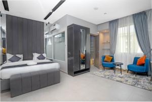 Letto o letti in una camera di GTA HOTEL IKEJA