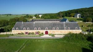 an aerial view of a large building with a red door at Le Clos Chavigny in Lerné
