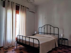 Postel nebo postele na pokoji v ubytování Il Patio - Villa indipendente con ampio cortile e giardino interno
