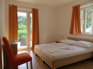 Кровать или кровати в номере Guest House Kukuljica 2