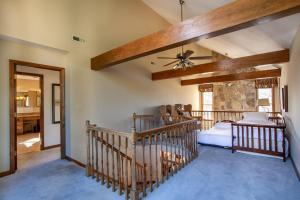 a bedroom with a bed and a ceiling fan at Misty Lake Hot Tub w Lake Access in Oak Ridge
