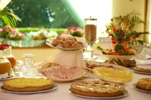 a table topped with lots of different types of food at Hotel Portonuovo in Vieste
