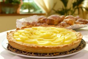 a pie sitting on a plate on a table at Hotel Portonuovo in Vieste