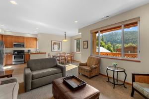 a living room with a couch and a table at Trails Edge Condo Townhouse A in Leavenworth