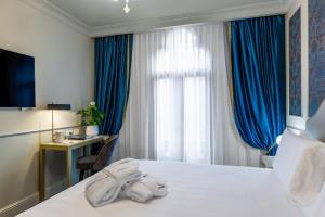 Postel nebo postele na pokoji v ubytování Hotel Palazzina Sardi