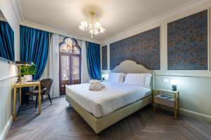 Postel nebo postele na pokoji v ubytování Hotel Palazzina Sardi