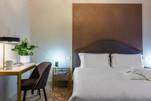 Postel nebo postele na pokoji v ubytování Hotel Palazzina Sardi
