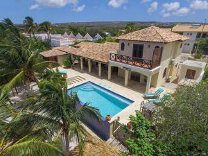 an aerial view of a house with a swimming pool at Beach Villa Casa del Mar in Kralendijk